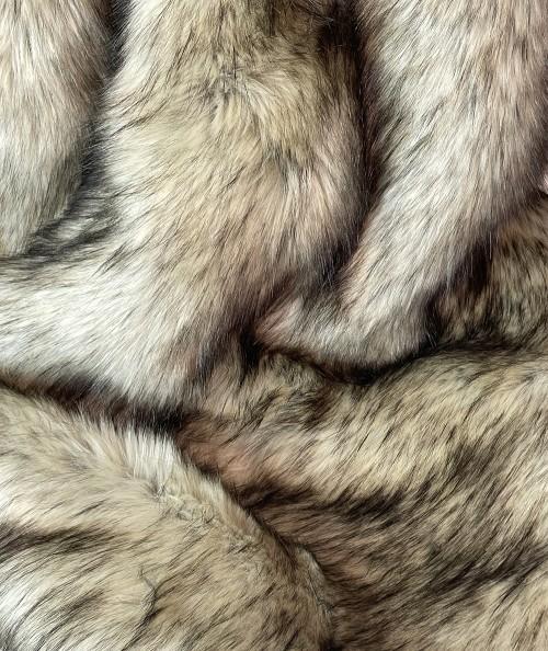 Close up image of long haired luxury brown faux fur fabric