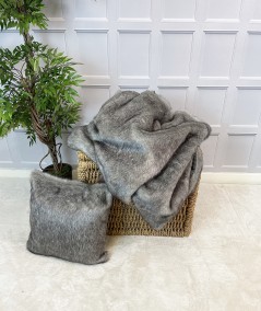 Grey fur blanket with grey fur cushion