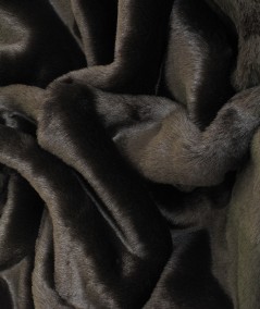 Close up image of brown medium length faux fur fabric