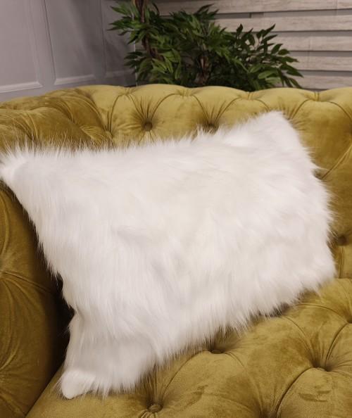 Rectangular white fur cushions