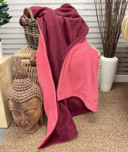 Pink and maroon reversible fleece blanket