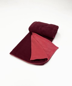 Reversible wine and coral fleece blanket