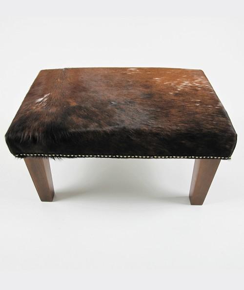 Small rectangular cowhide footstool 310