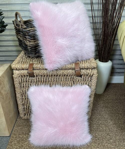 Modern pale pink faux fur cushions